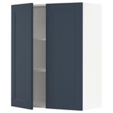 Dark blue kitchen cabinet with one open door showing a shelf inside.