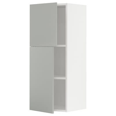 A light grey METOD kitchen wall cabinet with two doors. Its rectangular, with smooth surfaces and clean lines, giving a modern look.