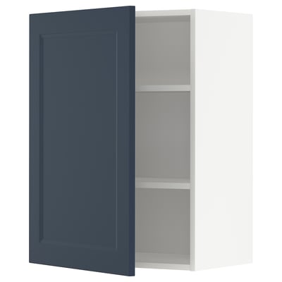 Open dark blue ikea METOD kitchen cabinet with two shelves.