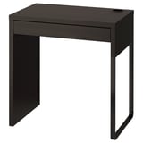 Black MICKE desk: sleek, small, rectangular, with one drawer, sturdy metal legs.