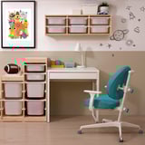 MICKE desk setup: small white desk with storage, turquoise chair, wooden shelf with colored drawers. Bright decor, kid-friendly design.