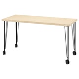 A honey-colored MITTCIRKEL desk with black metal legs and wheels.