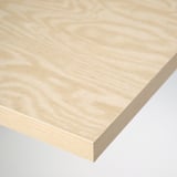 Close-up of a smooth, light-colored wooden tabletop with a natural grain pattern, showcasing its high-quality finish and layered construction.
