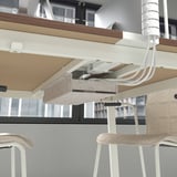 Office table MITTZON with cable management. Chairs visible underneath.