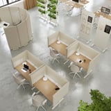 MITTZON desks with adjustable heights in neat office setup, beige dividers, chairs, and plants.