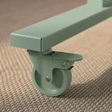 Green rolling table leg with lockable wheel and heavy-duty construction.