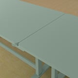 Foldable conference table with lockable wheels, ideal for flexible meeting spaces.