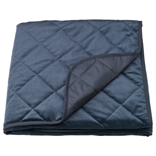 Dark blue MJUKPLISTER velvet bedspread, recycled polyester, folded, diamond quilted pattern.