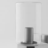 Wall lamp with sleek design and metal holder.