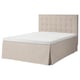 A beige MOSTERHAMN bed with a tufted headboard and a skirted base. The bed is rectangular and designed for comfort.