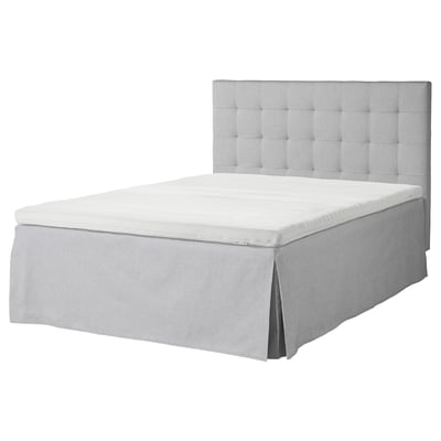 Gray MOSTERHAMN bed with light gray tufted headboard and matching skirt.