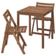 Option: Brown outdoor table with two folded wooden chairs.