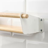 Modern wall shelf with wooden rail, securely attached to clean white wall. High-quality materials and sleek design ensure durability and organization.