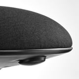 Close-up of high-quality office chair seat; soft, textured fabric over firm cushion, affixed securely to sleek, black base.