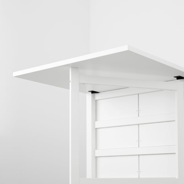 White table with adjustable leaves and wooden legs, ideal for small spaces.
