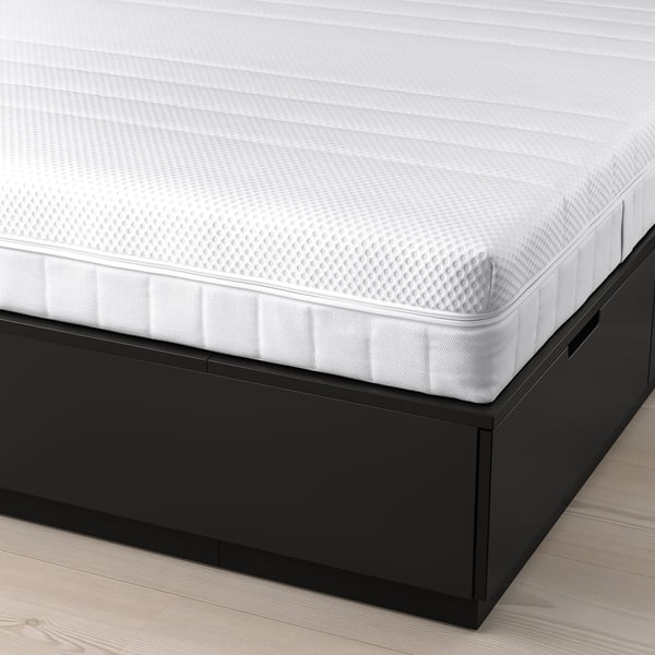 NORDLI bed with storage drawers and soft mattress.