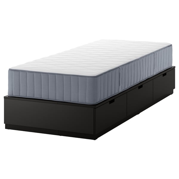 An IKEA NORDLI bed frame in black with three drawers and a gray mattress. It offers storage and space efficiency in a compact design.