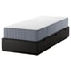 An IKEA NORDLI bed frame in black with three drawers and a gray mattress. It offers storage and space efficiency in a compact design.