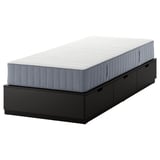 NORDLI: black, rectangular bed base with 3 drawers and a gray mattress.