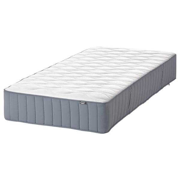 IKEA NORDLI bed, blue, rectangular, padded, soft top, grey bottom, brand label visible.