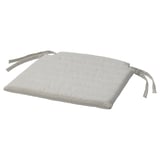 A light gray NORDVIKEN chair cushion with ribbon ties and a zipper for easy washing.