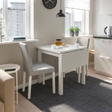 Nordvik drop-leaf table with grey chairs. Foldable, compact for small spaces. Ideal for 2-4 people.