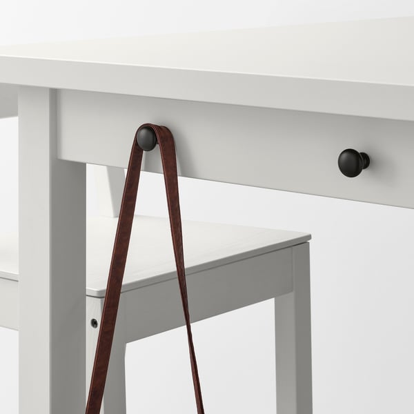 A white NORDVIKEN bar table with hooks and drawer, featuring a brown leather strap.