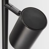 Modern black lamp with cylindrical shade and extendable arm, showcasing sleek design and high-quality finish.