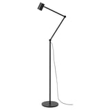 Black NYMÅNE floor lamp with adjustable arm, modern, minimalist design, stands on circular base.
