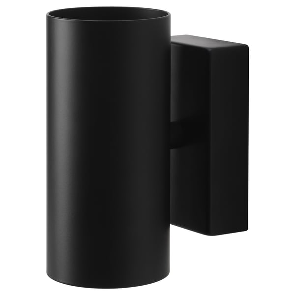 Black modern wall lamp NYMÅNE with cylindrical shade, emitting light upward and downward, made of aluminum and steel with a powder-coated finish.