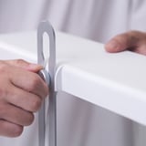 Person adjusting growing lamps height.