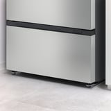 NYTTIG floor protector under refrigerator, guards against leaks.