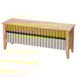 OMMJÄNGE bench with a yellow and black striped cover. Made of pine with a woven fabric, it has a rectangular shape and traditional charm.