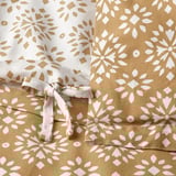 Duvet cover with decorative tie closure, reversible geometric print.