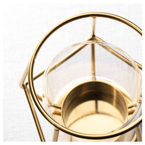 Gold-framed candle holder or, for fewer characters: gold candle holder