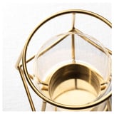 Gold-framed candle holder or, for fewer characters: gold candle holder