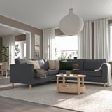 Modern living room with PÄRUP sectional, coffee table, large windows, pendant lamp, and rug.