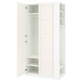 White IKEA PAX wardrobe with open doors, showing shelves and hanging space.