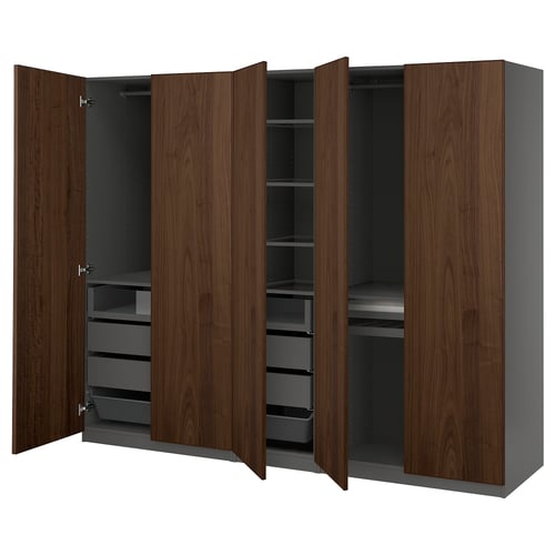 PAX wardrobe: wooden, brown doors open to dark shelves. Metal mesh basket, drawers, and glass shelves inside.