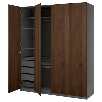A dark brown PAX wardrobe with wooden doors and shelves, featuring interior storage solutions.