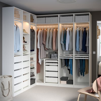 White PAX closet with multiple compartments, large wardrobe.