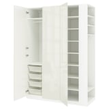 A white IKEA PAX wardrobe set with open doors revealing shelves and baskets.