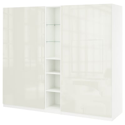 White PAX wardrobe with multiple doors, shelves, and drawers, sleek modern design, glossy finish.