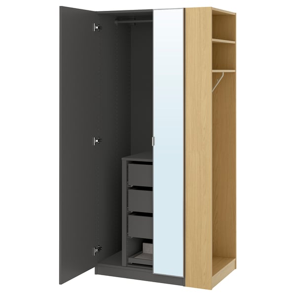 PAX black and light wood wardrobe, open showing drawers, shelves, and mirror.