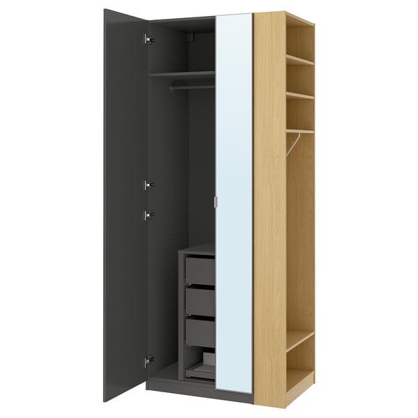 A PAX wardrobe in black with a mirrored section and light wood shelves, featuring adjustable shelves and a hanging rod.
