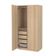 A light wood-colored standing wardrobe named PAX, featuring multiple drawers, a hanging rod, and a mesh basket.