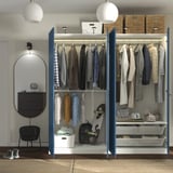 Organized clothing storage with hanging garments, shelves, and baskets. Includes lighting and adjustable.
