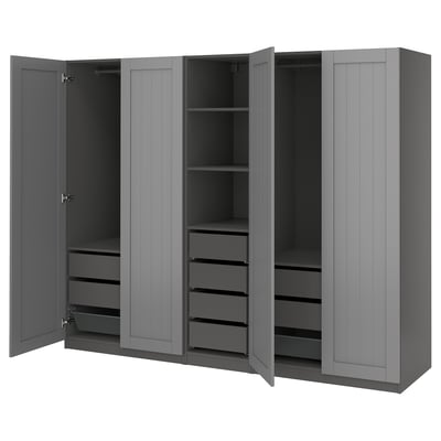 A gray PAX wardrobe with open doors, revealing shelves and drawers inside.