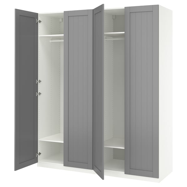 A gray ikea PAX wardrobe with open doors, revealing shelves and hanging rail.