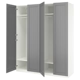 A gray ikea PAX wardrobe with open doors, revealing shelves and hanging rail.